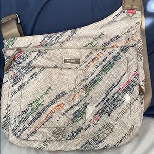 Gently used crossbody Tumi purse!
